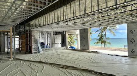 Closed-cell insulation applied to attic rafters in Miami