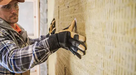 Rigid foam insulation applied to attic rafters in Miami