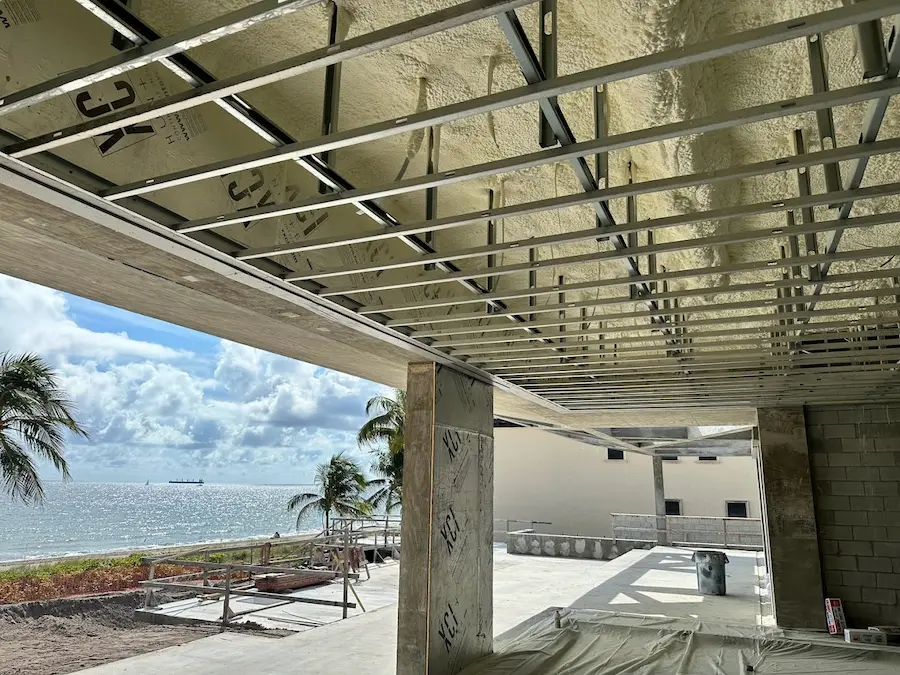 Open-cell spray foam applied to attic rafters
