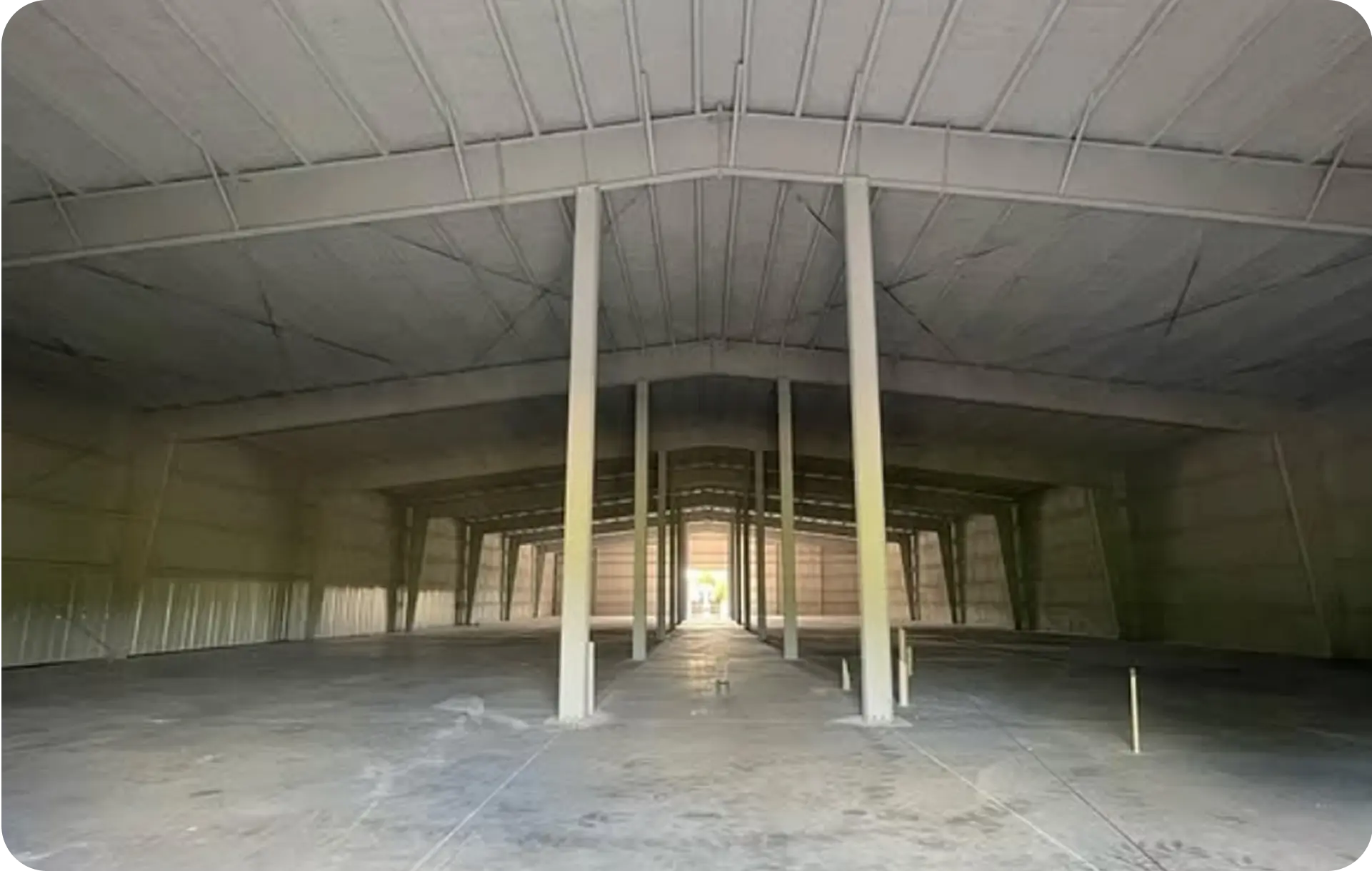 Commercial warehouse with spray foam insulation on metal roof deck and walls in Miami-Dade County